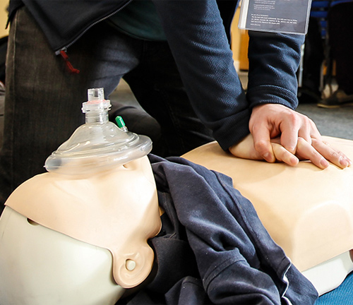 First aid image of someone practising cpr