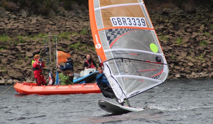 Windsurfer starting a race in lots of breeze at BYS Windsurfing Regional Championships at Glossop SC 2022 