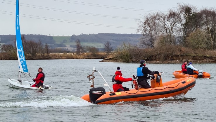 Two powerboats and a dinghy on the water for an RYA North East powerboat skills day at North Yorkshire Water Park in February 2022.