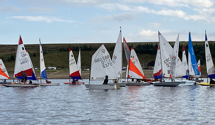 Colourful variety of youth and junior dinghies on the water at NEYYTS event at Yorkshire Dales SC 2021 