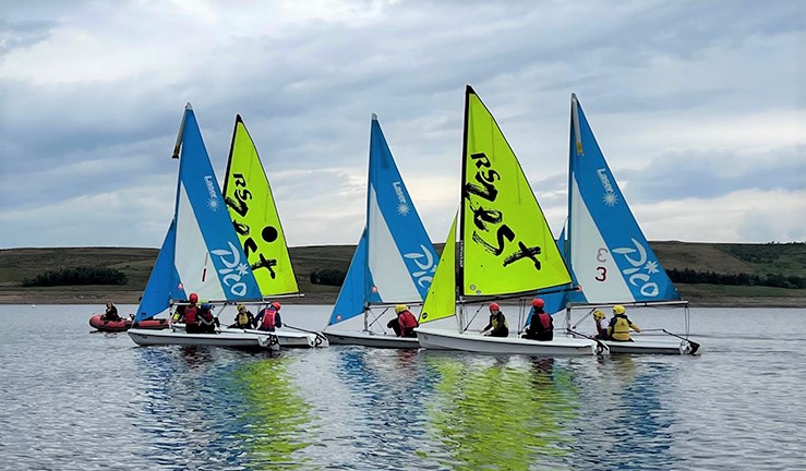 Five training dinghies on the water with a powerboat at Yorkshire Dales SC 