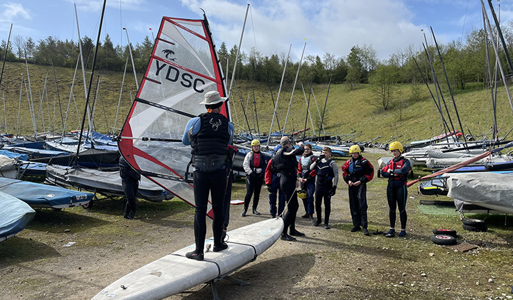 Windsurfing course demonstration on shore by coach at Yorkshire Dales SC