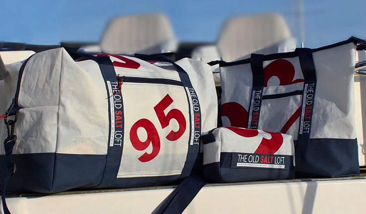 Old Salt Loft bags displayed on a boat