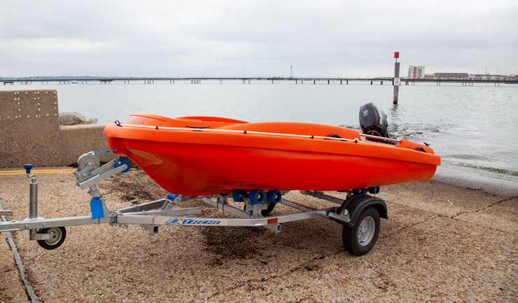 RYA and Suzuki Safety Boat competition. Suzuki powered safety boat and trailer on slipway.