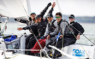 Group of sailors on yacht racing