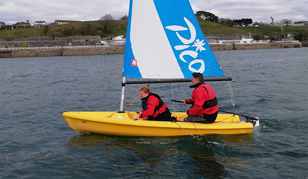 Dad and son dinghy sailing