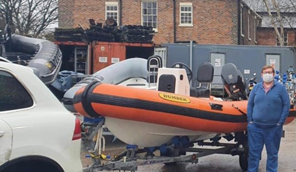 man stood next to new RIB on trailer