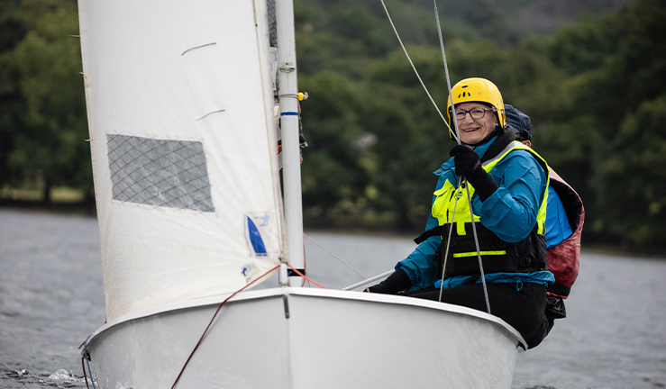 Mid shot of person sailing small boat