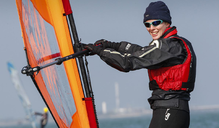 Female windsurf in cold weather gear