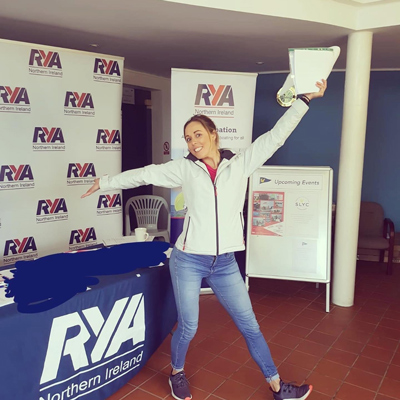 Lisa posing in front of a RYA stand 