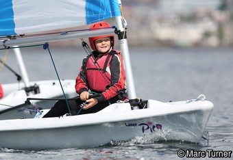 Happy young sailors in small single person Pico dinghies.