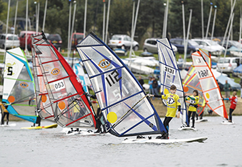 A group of young windsurfers