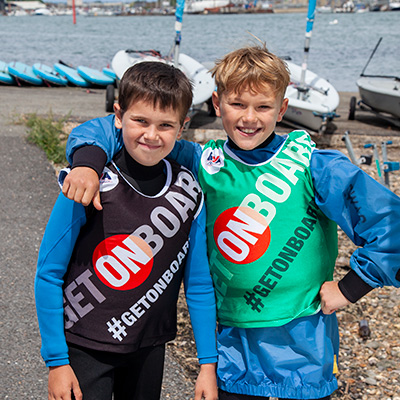 two happy sailing children smiling for the camera
