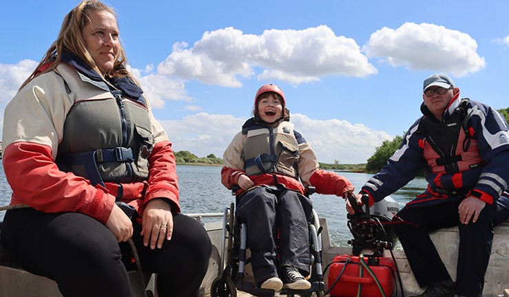 mid shot of a sailor/sailors on a lake