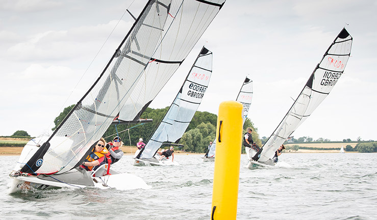 mid shot of a sailor/sailors on a lake