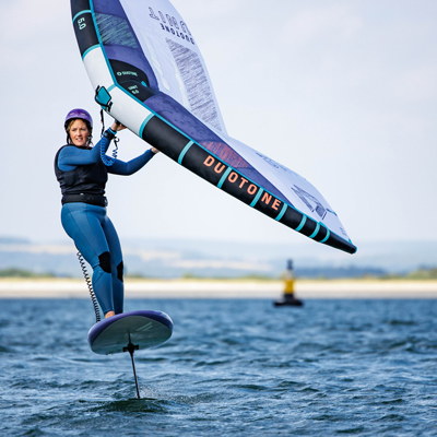 woman windsurfing in full gear 