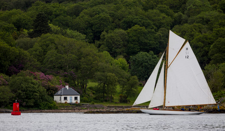 wide shot of boat sailing on kyles of bute