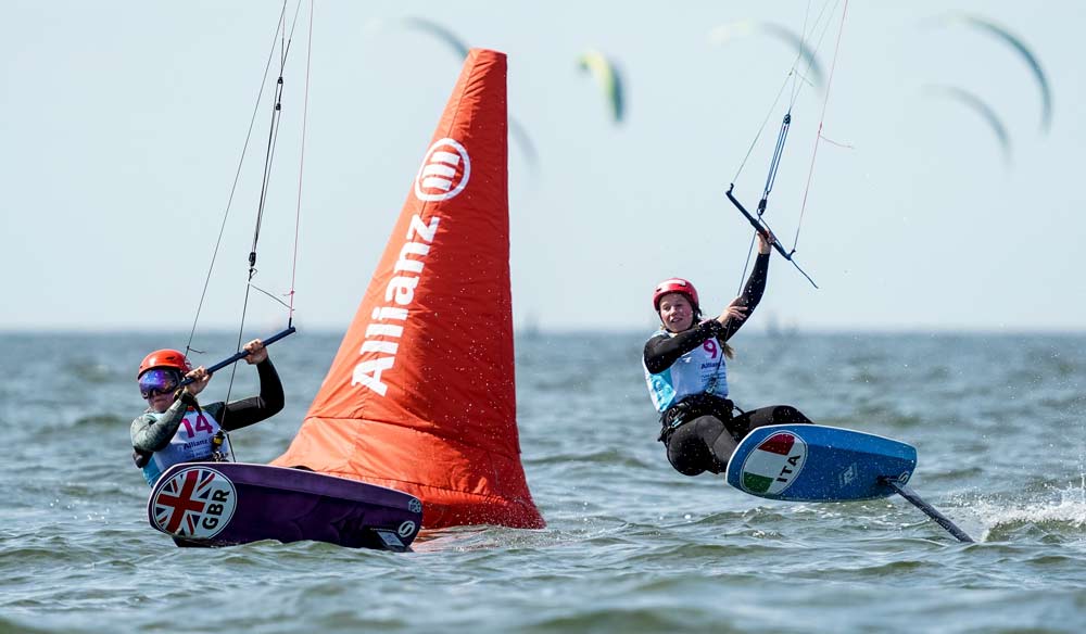 2 kiteboarders rounding a racing mark