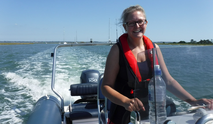 Women driving rib cruising on the solent