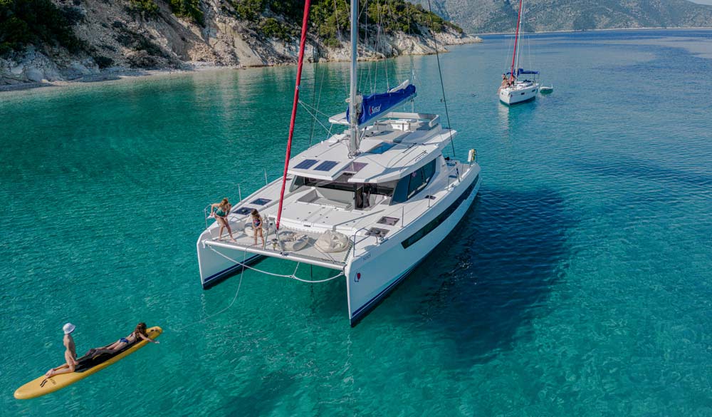 Sunsail catamaran and monohull at anchor
