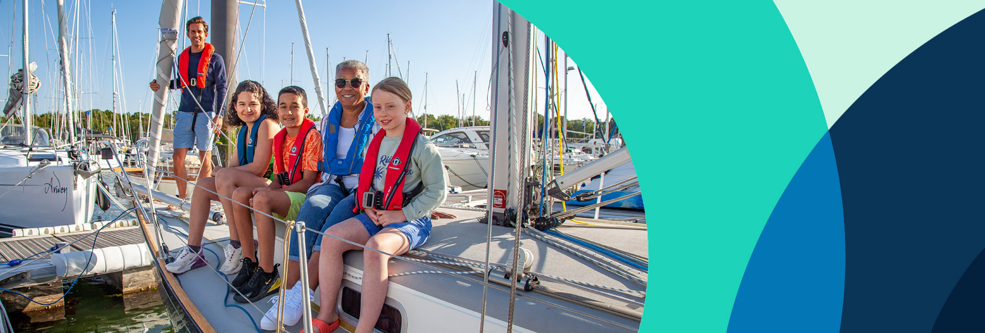 wide shot of family smiling while sitting of a sailing yacht