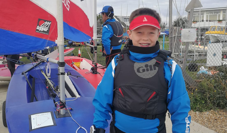 Boy setting sail