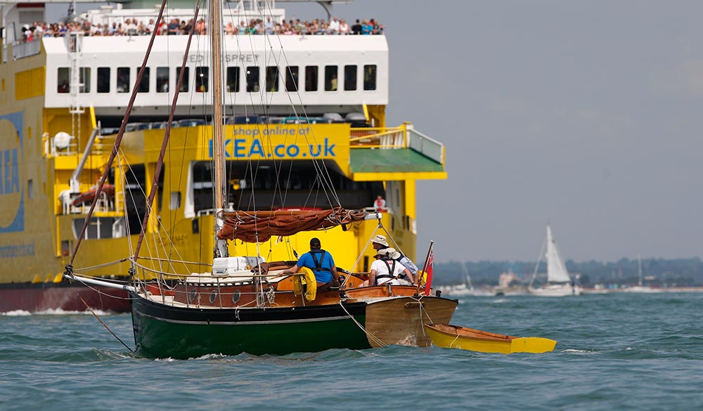 cargo ship and yacht