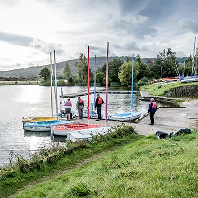 people sailing next to a club