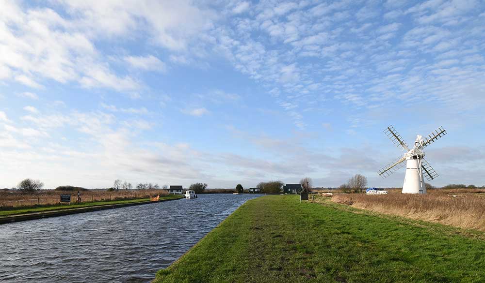 Wide shot of windmill on Norfolk Broads 