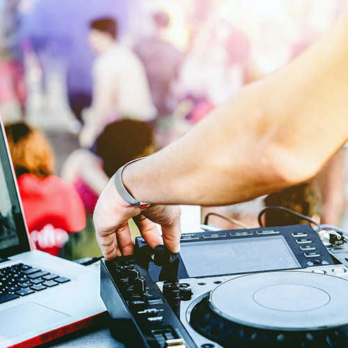 people dancing to DJ on a sunny day