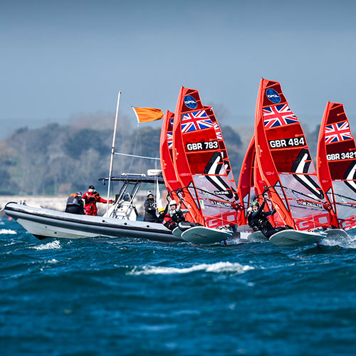 Race officials participating in a wind surfing race