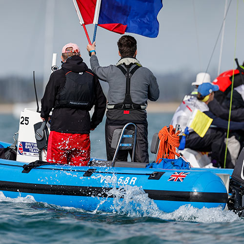 close-up of race officials in a ribb