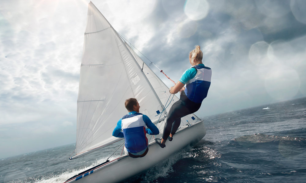 people racing in clean blue water
