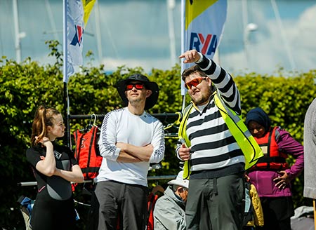 two volunteers talking about sailing