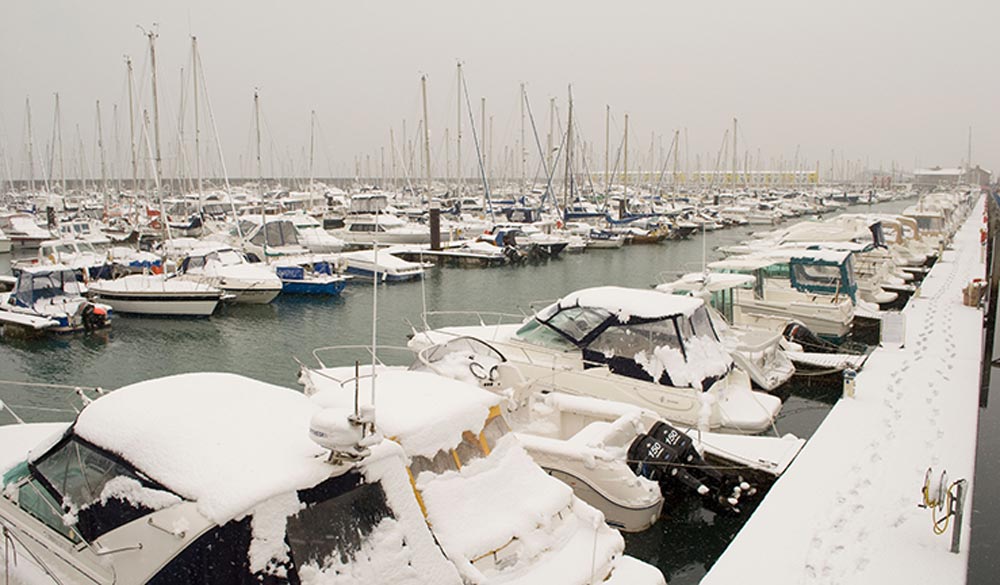 snowy boats on the water