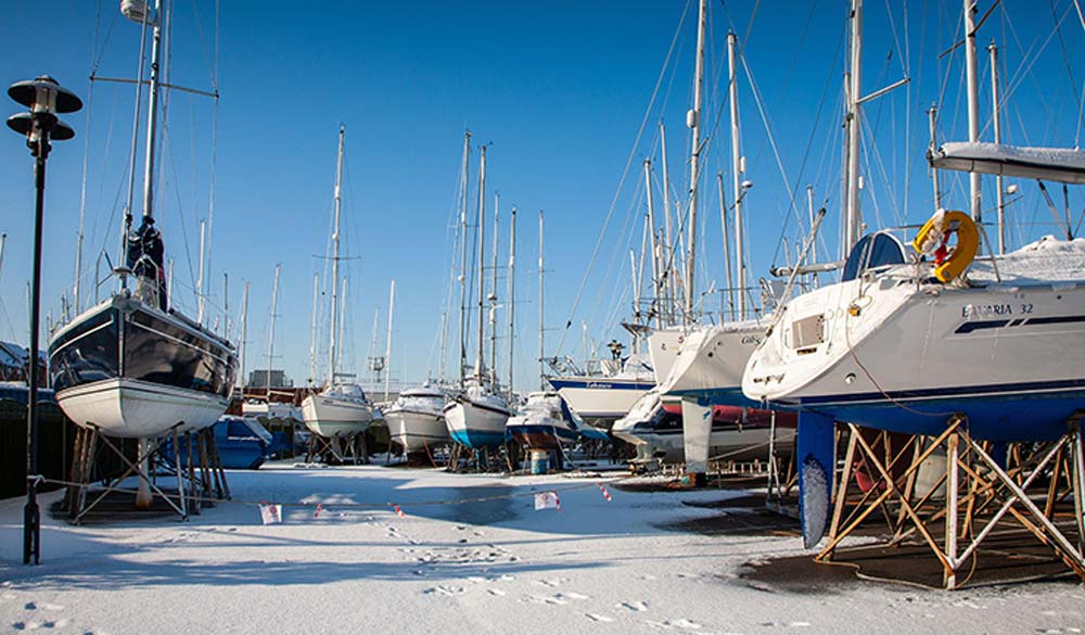 snowy boats ashore for winter