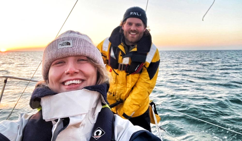 Wide shot of couple smiling on boat