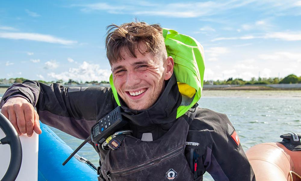 Kieron smiling on his boat 