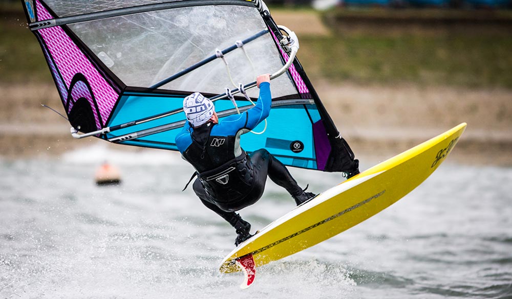 Windsurfing man leaping into the air