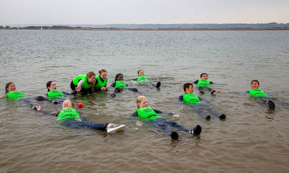 Kids floating in the water