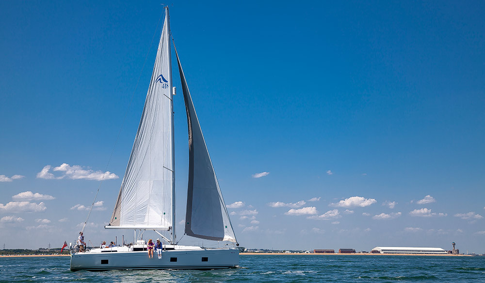 wide shot of a boat sailing in good weather 