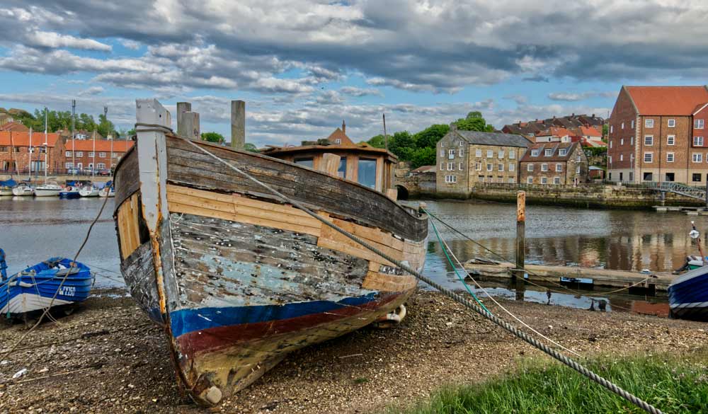 wide shot of old rusty boat