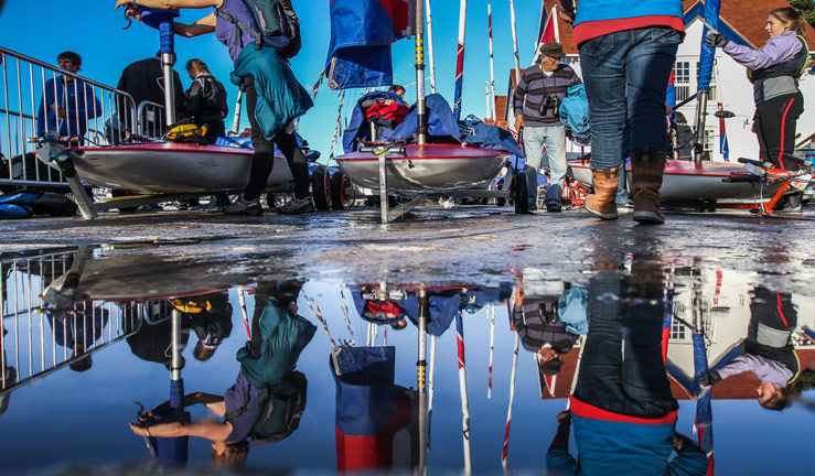 An image of people preparing their boat for the water.