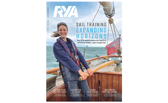 RYA Magazine Cover - woman at the helm of a yacht 