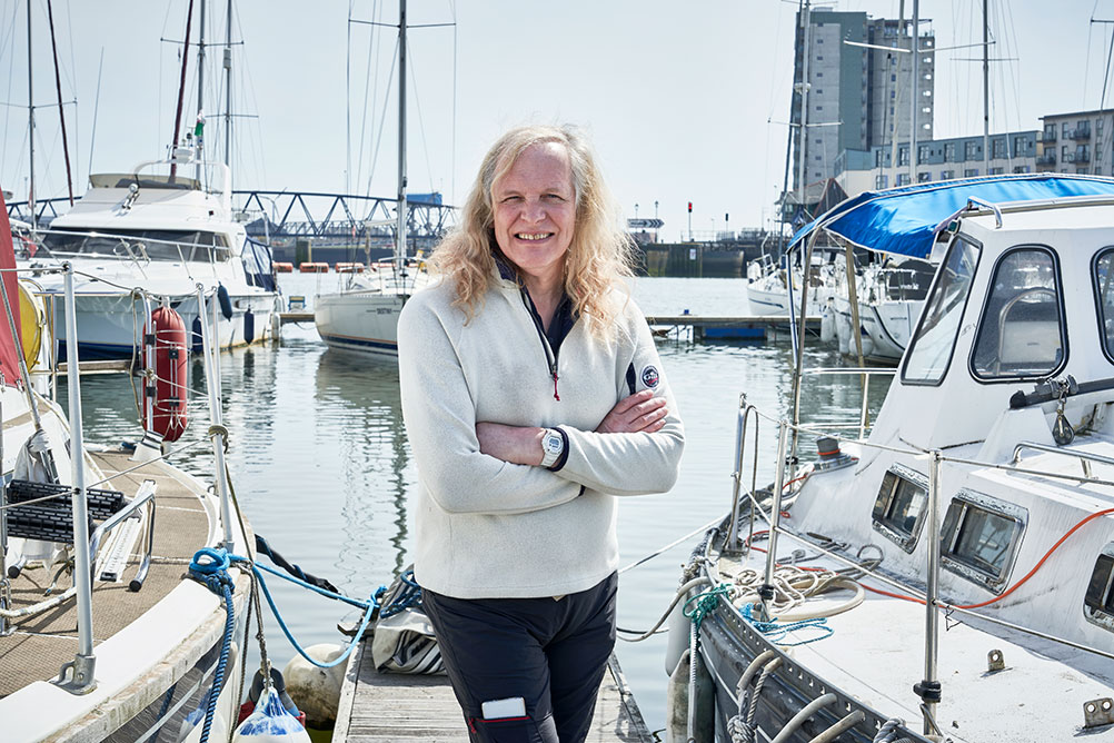 Mid-shot of person standing on a harbour