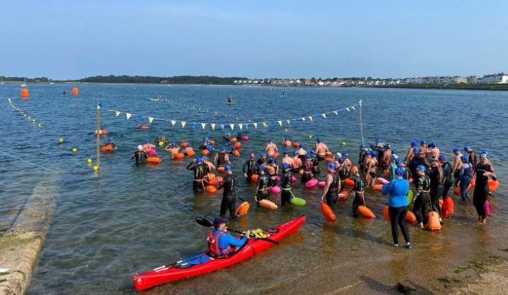 Approximately 50 swimmers take to the water on Ballyholme Yacht Clubs slipway.