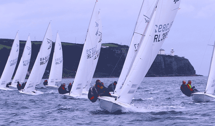 Flying Fifteens racing in front of Blackhead Lighthouse