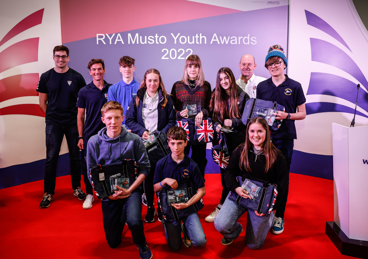 A group of young sailors receive an RYA Musto Youth Award