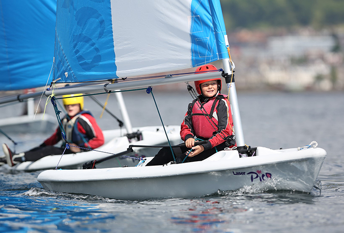 A junior sailor sailing a pico dinghy