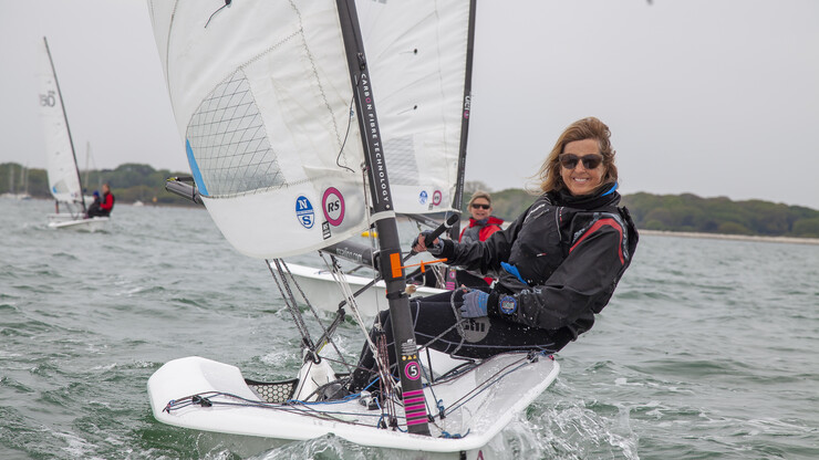 Two women dinghy sailing and coming towards the camera